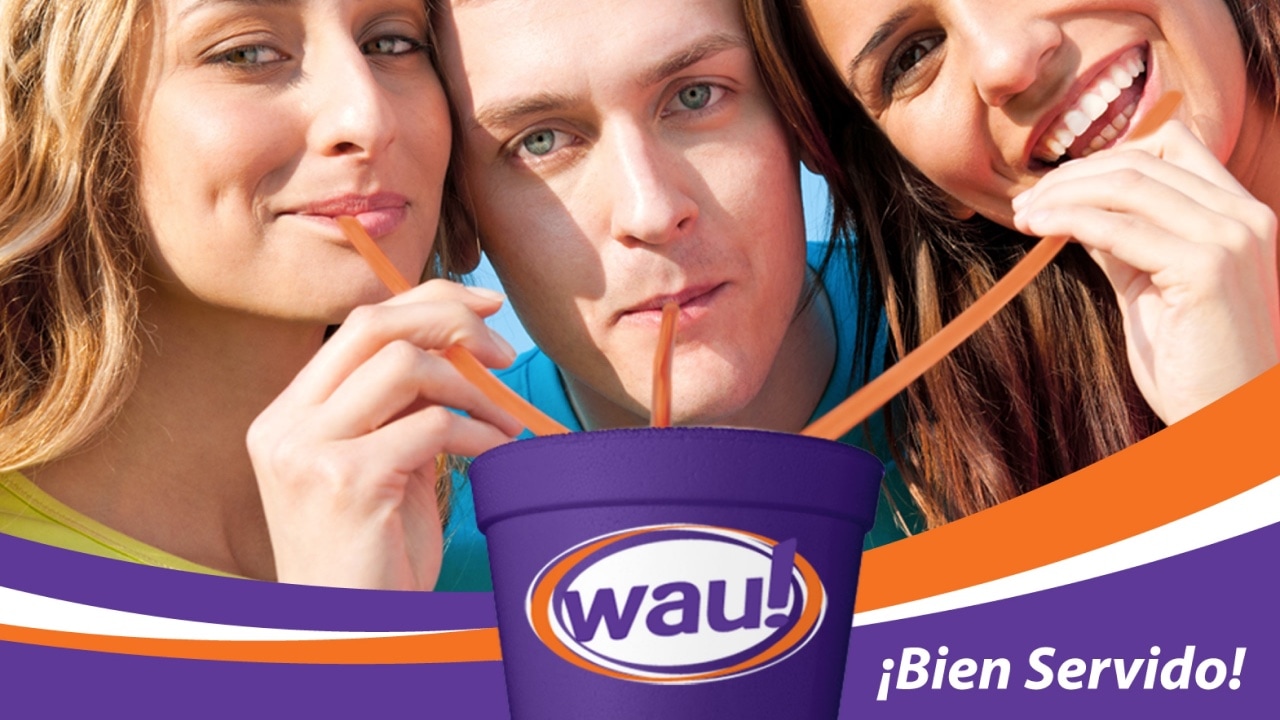 A group of people drinking from a cup with the word WAU! on it.