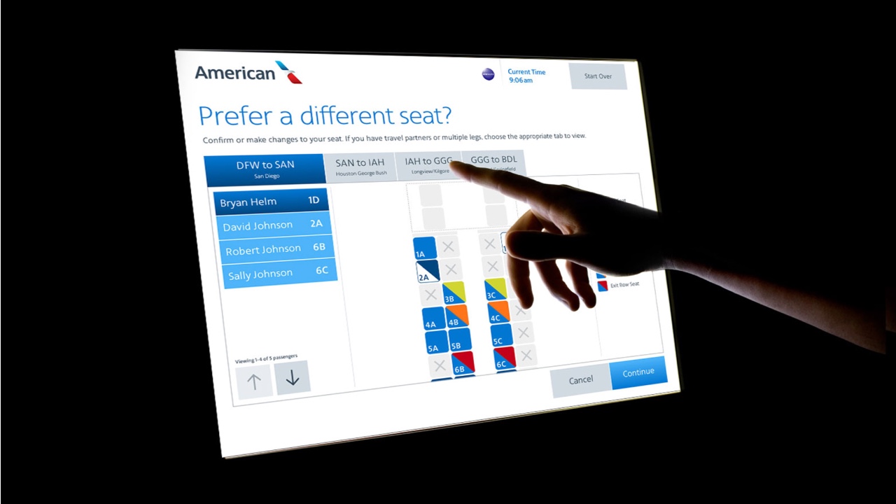 A person is pointing at a digitally aligned screen with a different seat displayed.