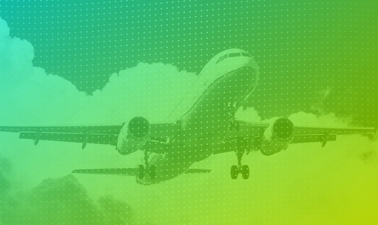 An airplane flying in the sky with a green and yellow background.