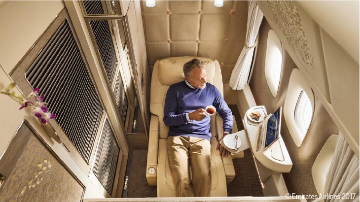 A man rests in the Emirates FirstClass cabin.