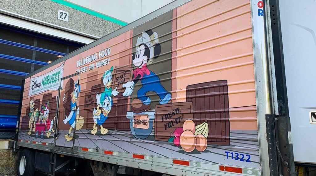 A truck with an image of mickey mouse on it.