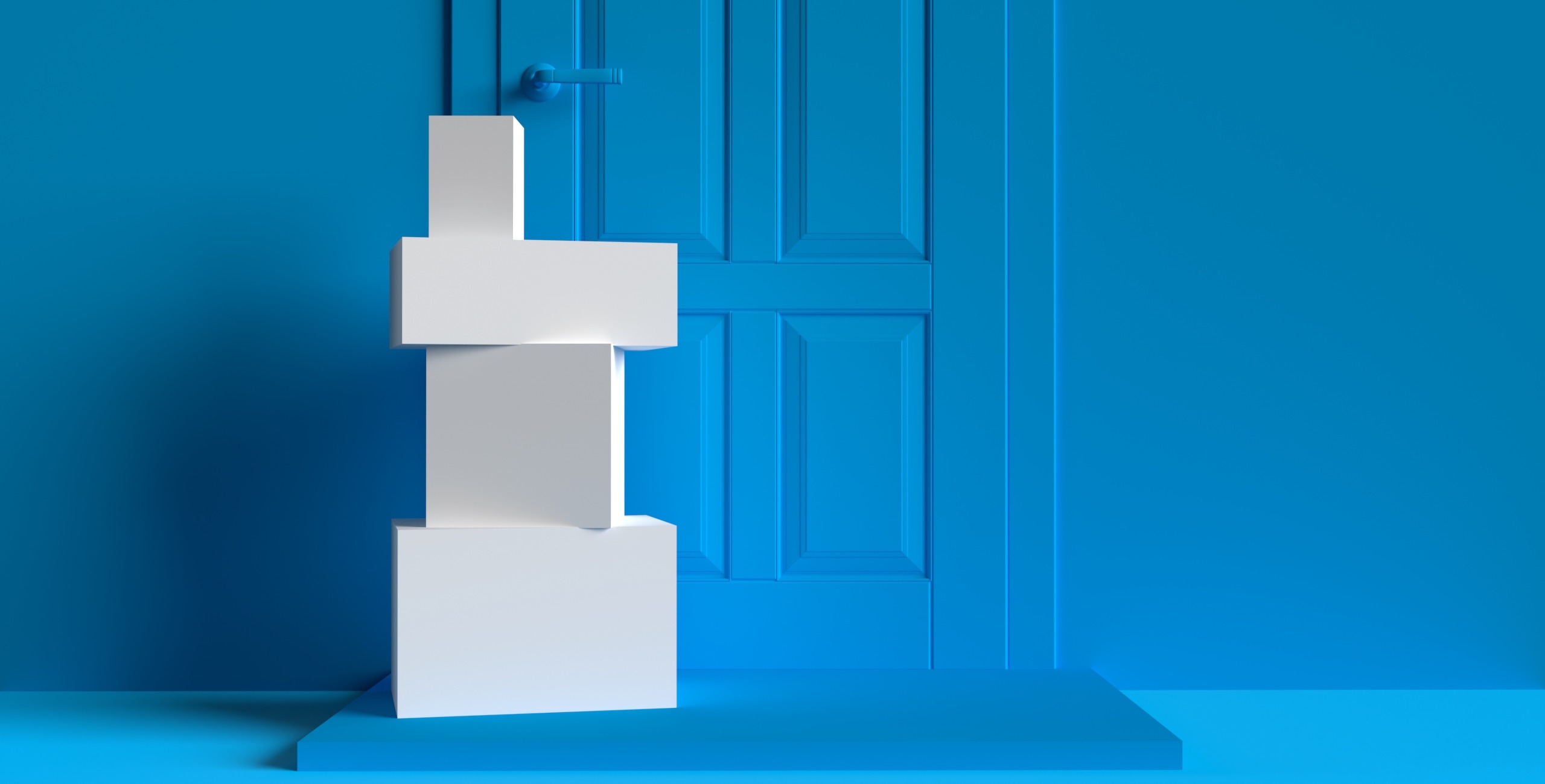 A stack of white boxes standing in front of a blue door.