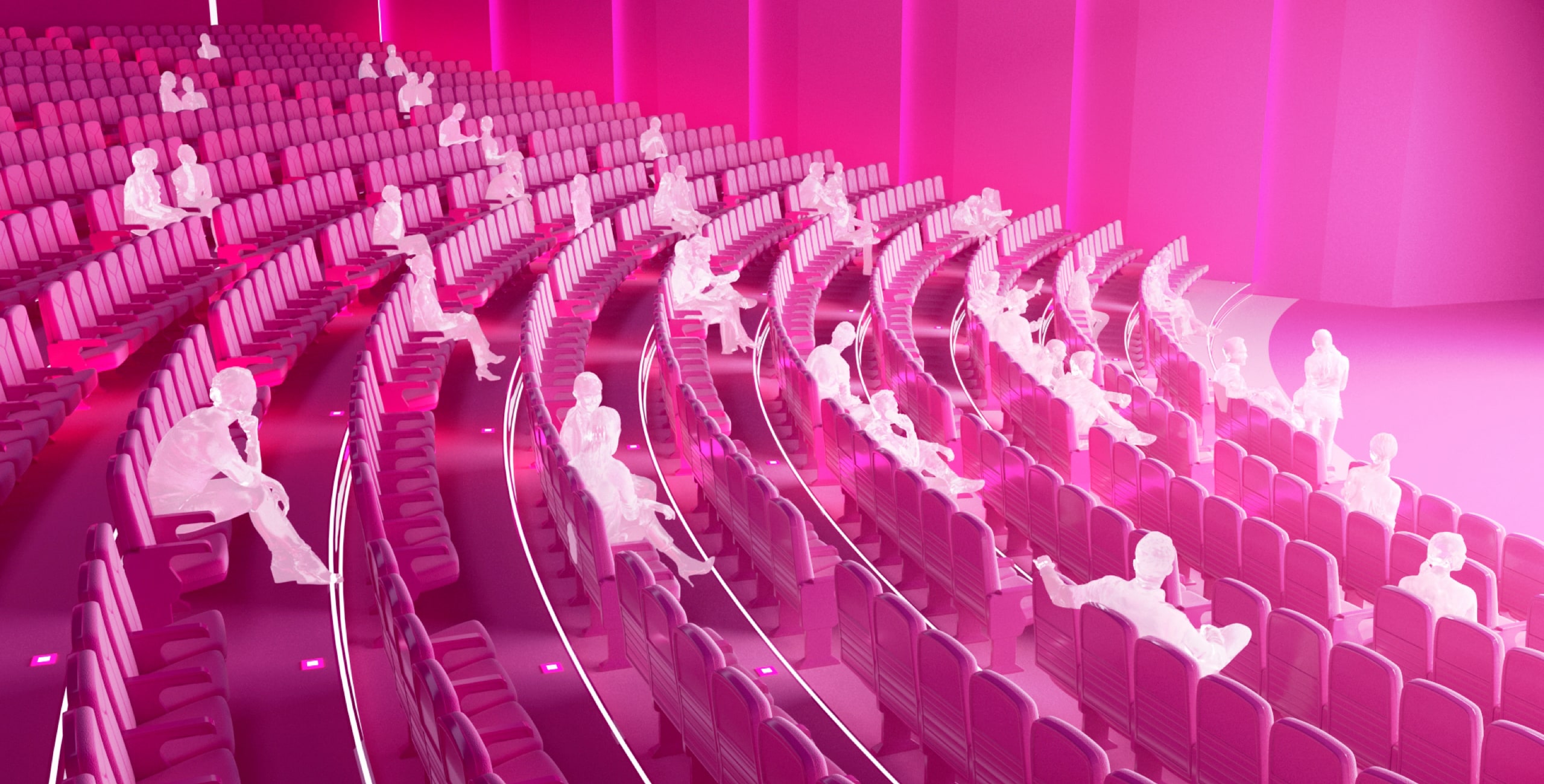 A group of people sitting in a pink auditorium.