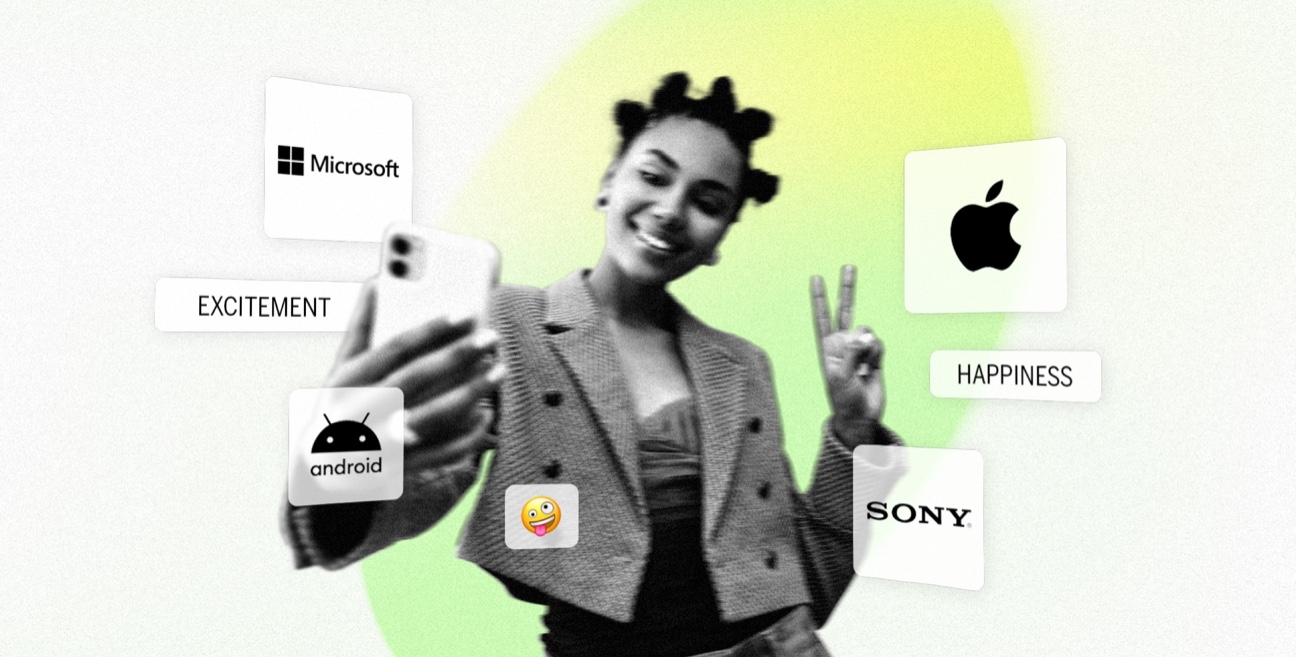 An image of a woman holding a phone with different logos on it.