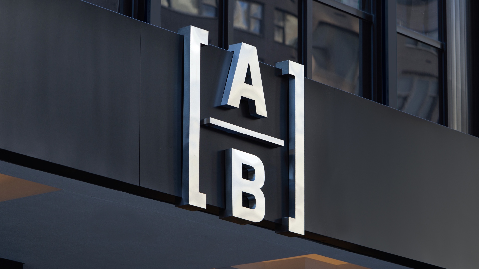 the new AB (AllianceBernstein) logo on the main facade of a building
