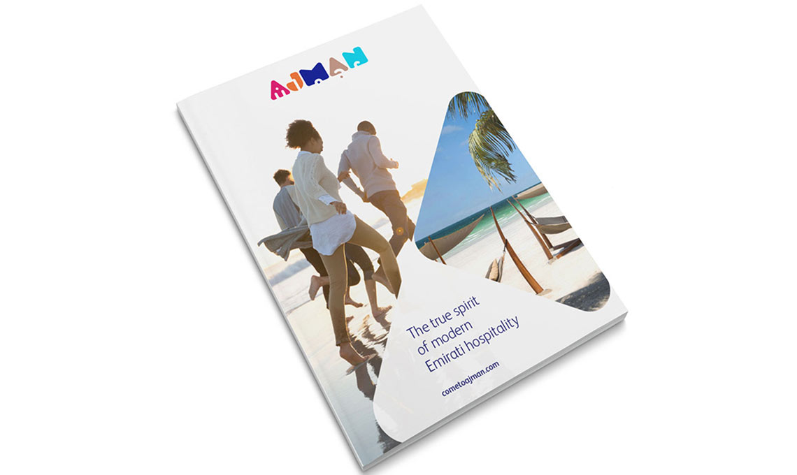 A brochure with a group of people walking on a beach.