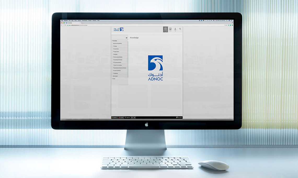 A desktop computer with the brand management system designed and developed for ADNOC with BrandOS