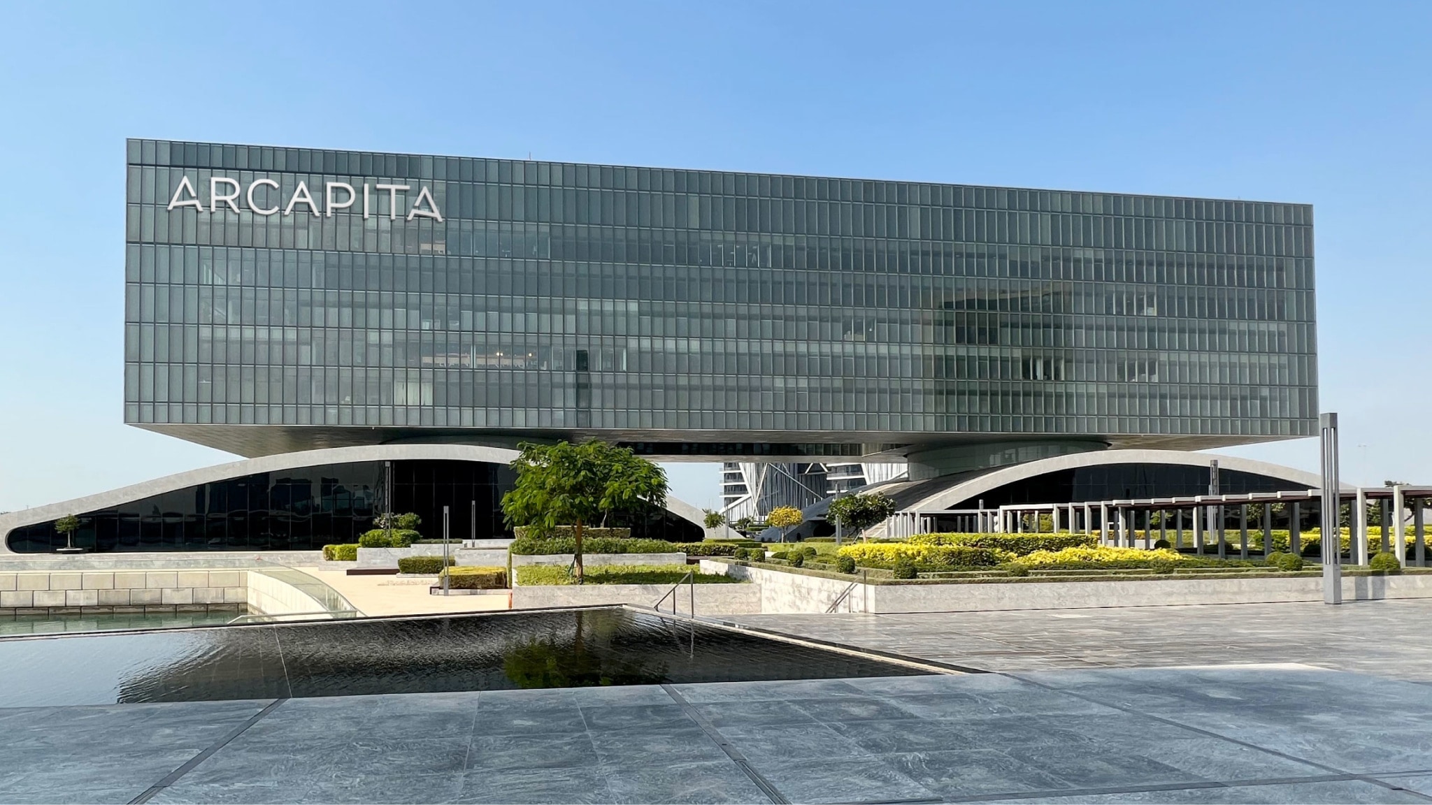 Arcapita's headquarters in Manama, Bahrain, showing the main building with the logo applied to the façade