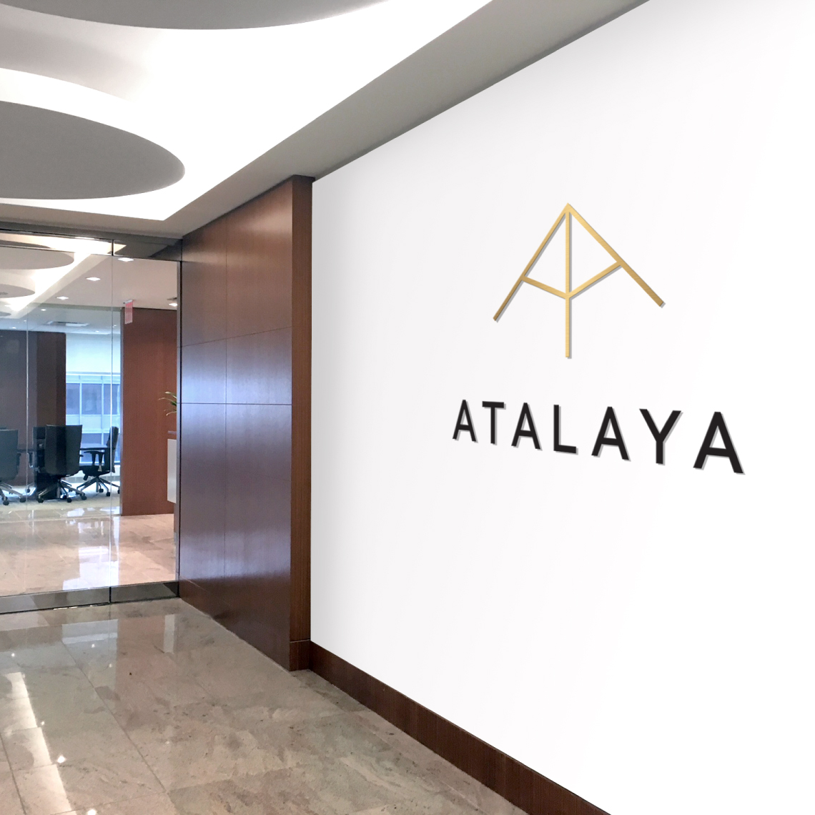 The wall of an office corridor with Atalaya's logo