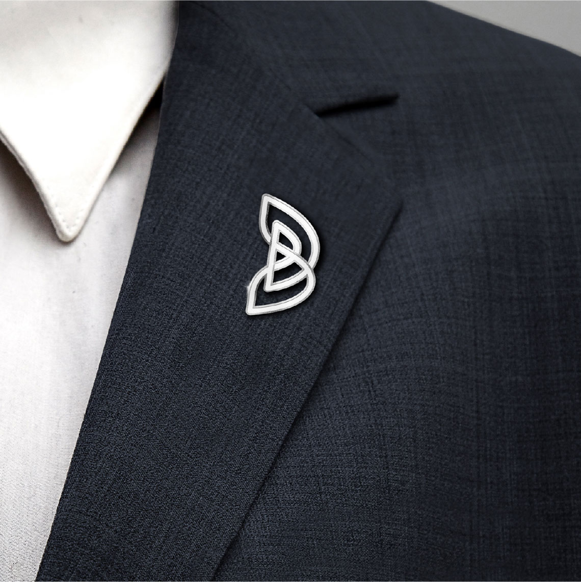 Beeah symbol applied as a pin on a suit lapel
