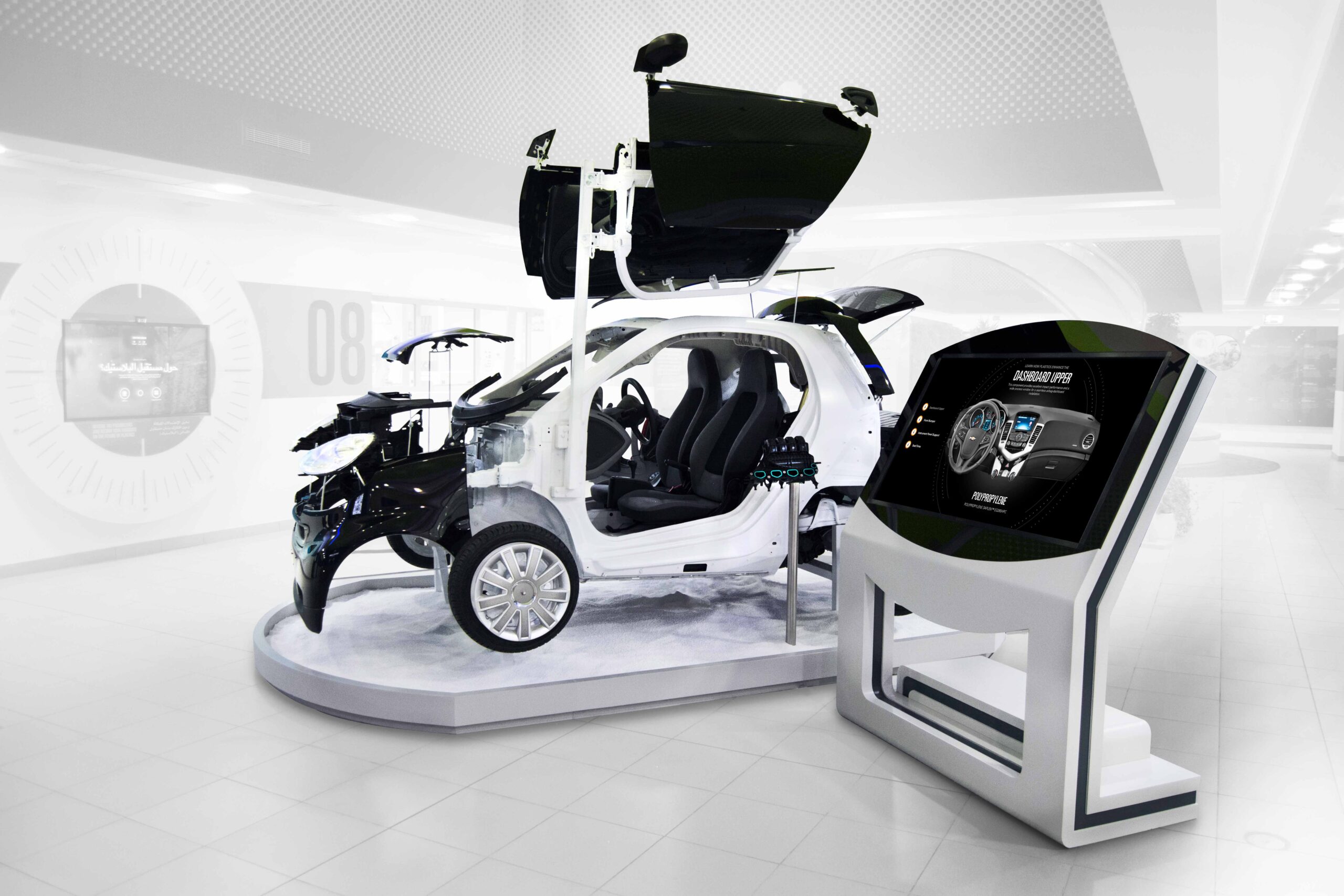 A multimedia life-size car that highlights plastic components using an interactive kiosk