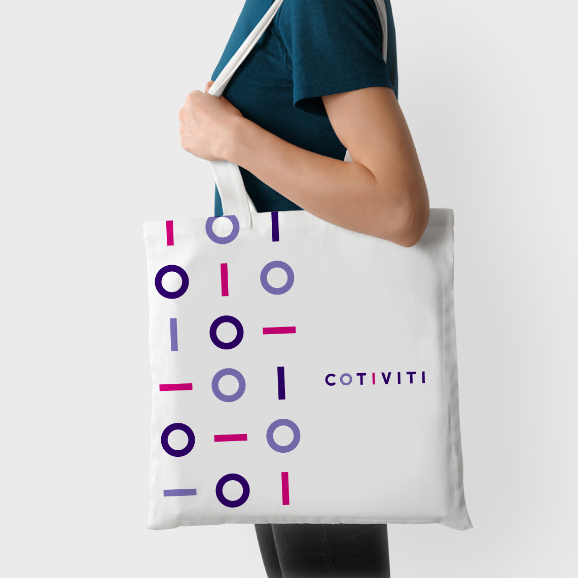 a woman carrying a branded conviti bag