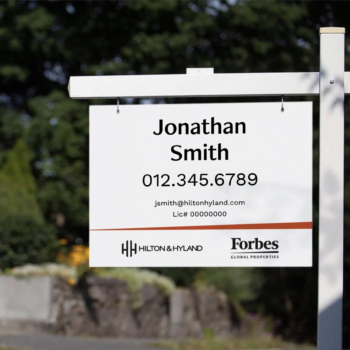 Example of the a real estate sign in front of a house developed for Forbes Global Properties