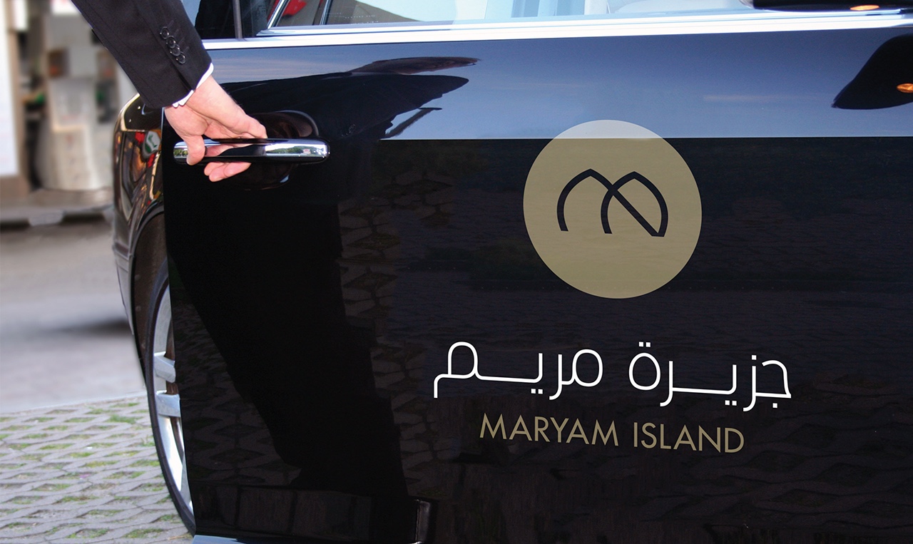 a very dark car door with the Maryam Island logo