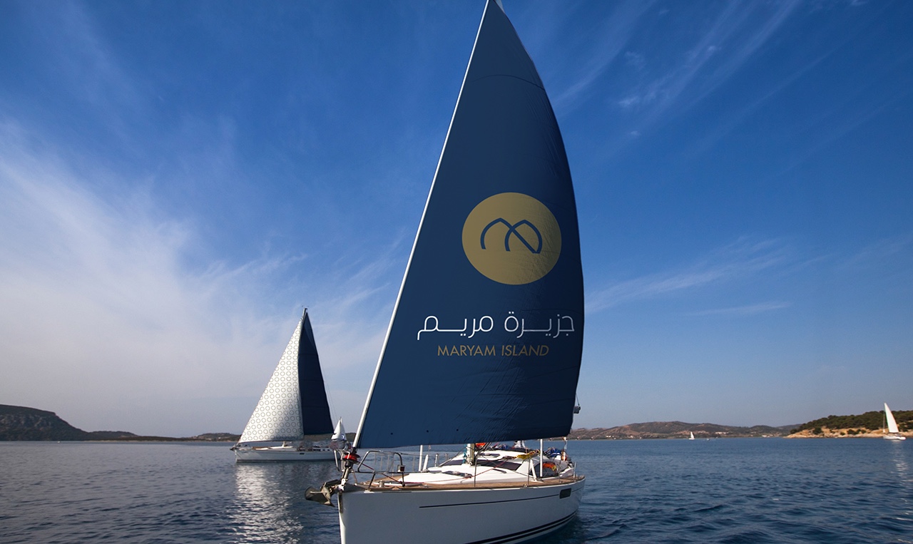 a boat with the logo of Mayam Island on its sail