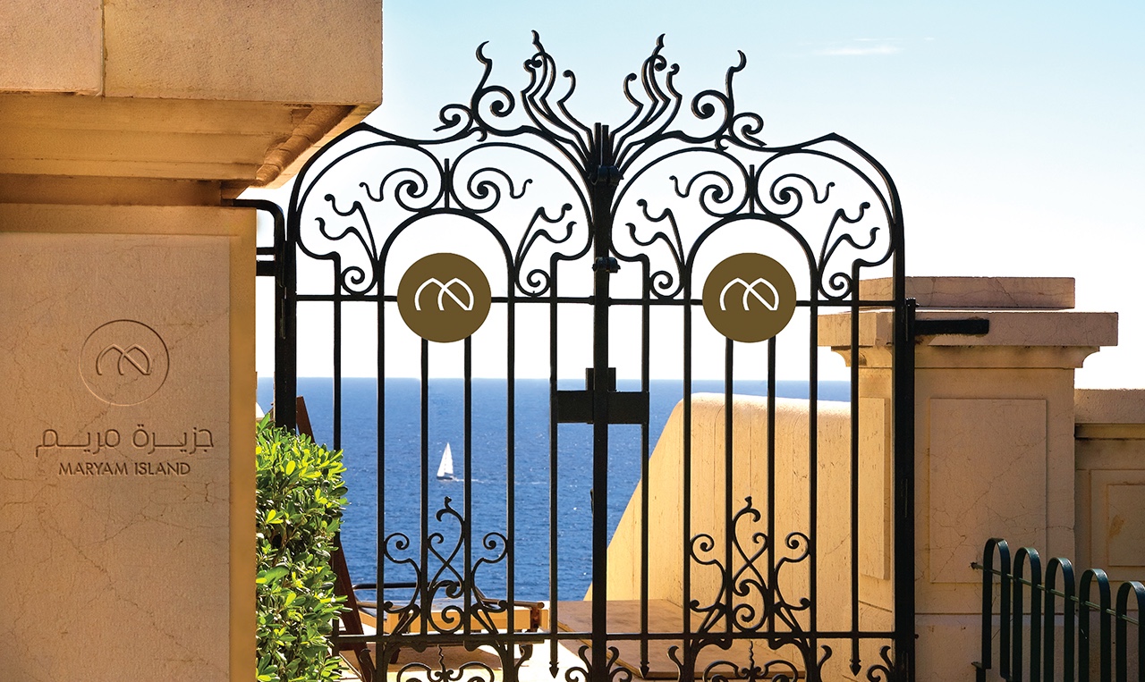 a gate with the Maryam Island logo on it.