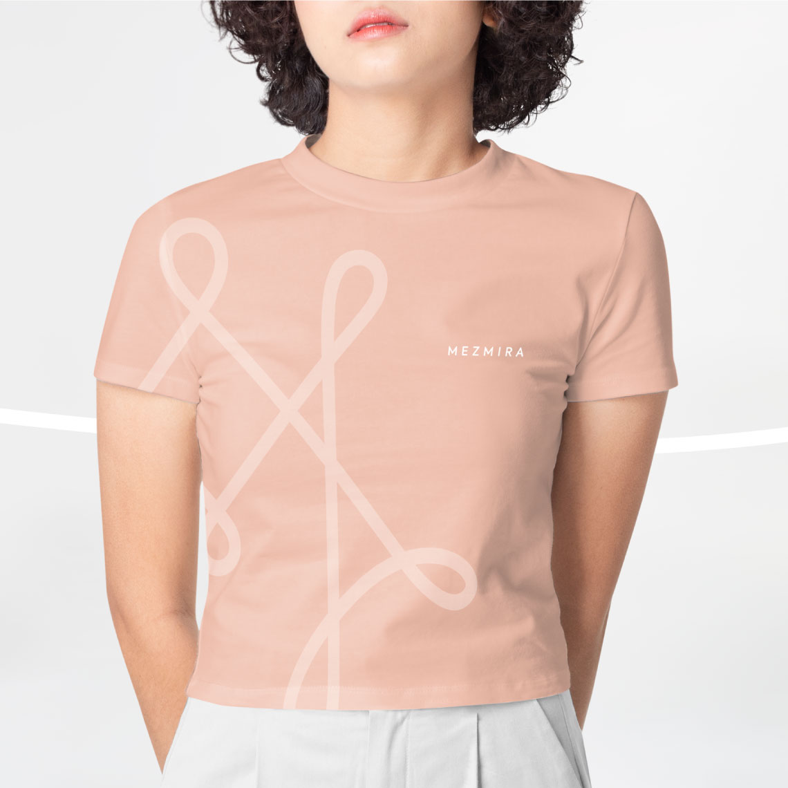 Mezmira logo and graphic motif applied on a stylish peach t-shirt