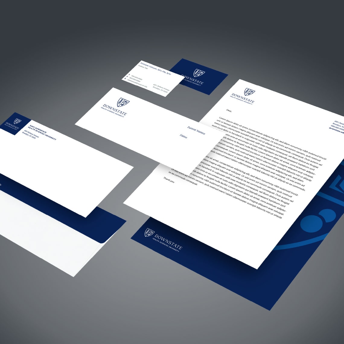 Examples of printed material including letter paper, envelope, business cards and folders