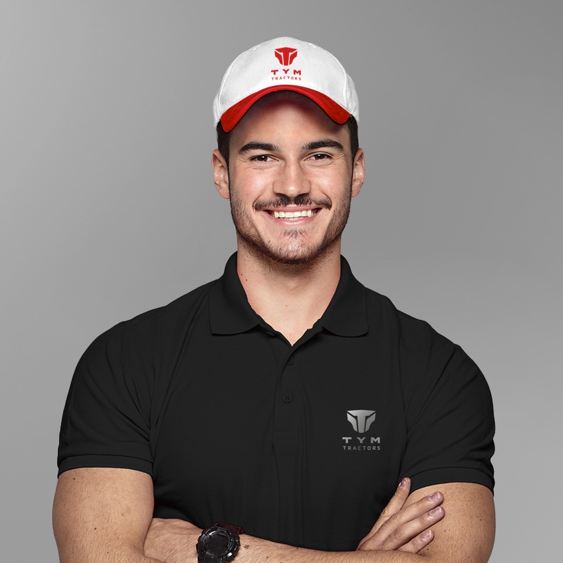 A smiling man with a baseball cap and a black t-shirt: examples of the design system could be applied to marketing materils