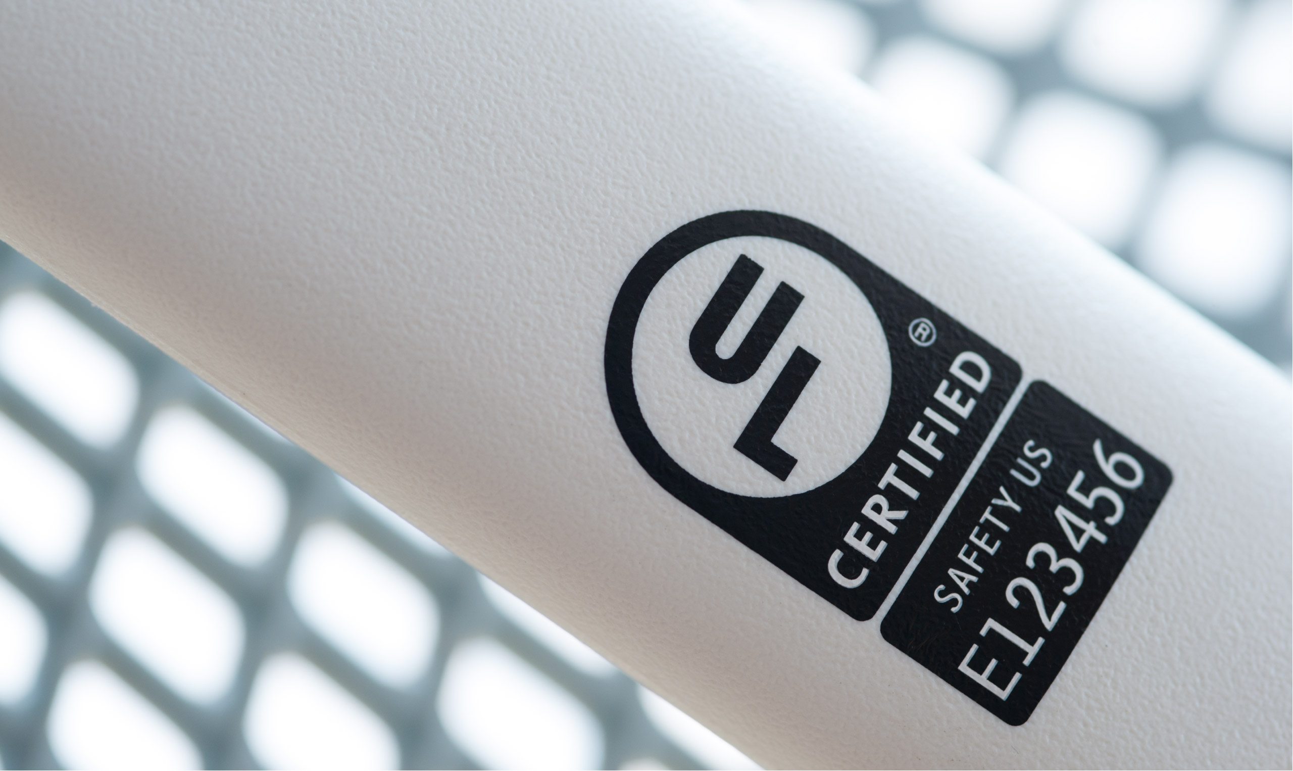 A close up of a white bottle with a logo on it.