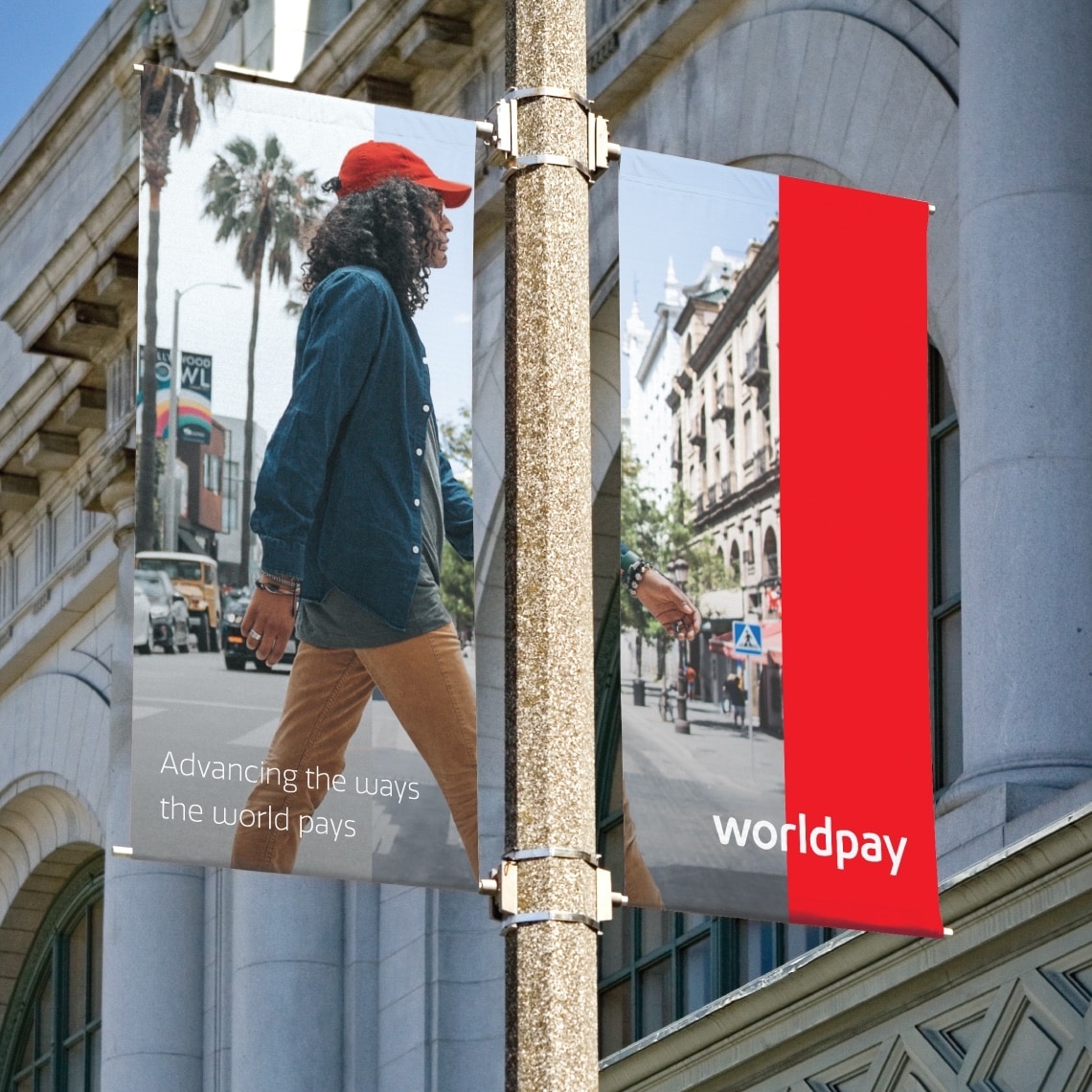Example of two flagpole banners showing how to apply the design identity for Worldpay