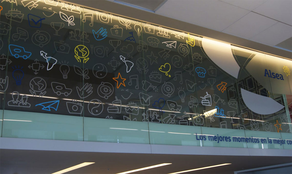 A glass wall displaying numerous signs for brand repositioning.