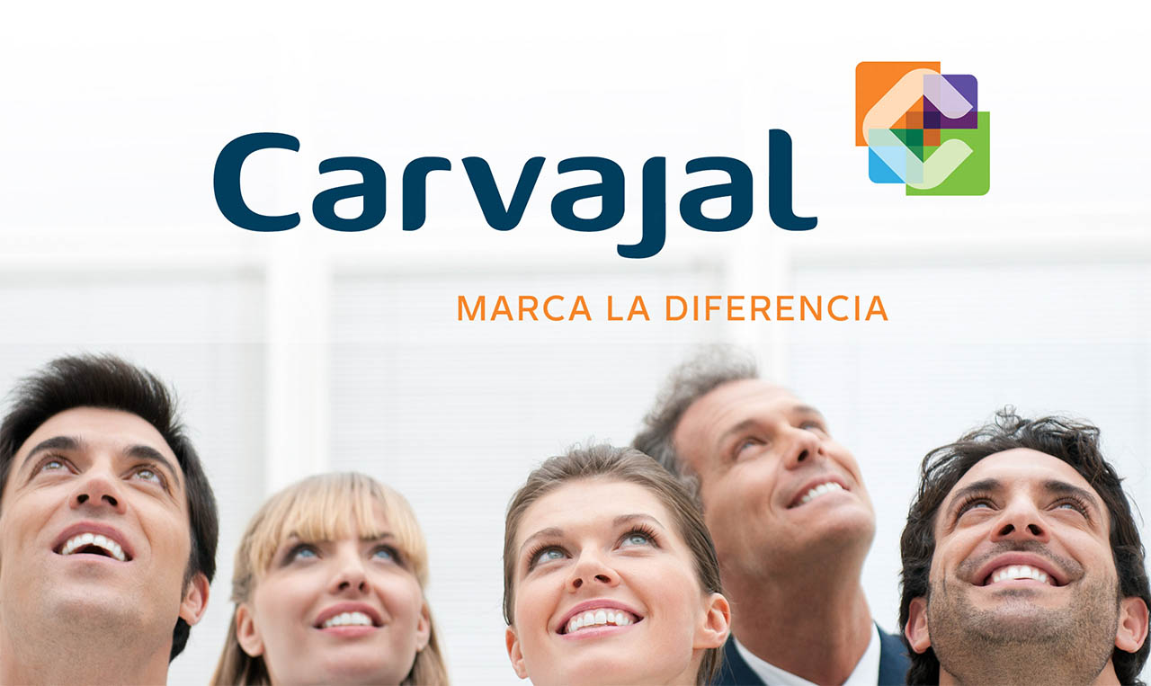 A group of people observing Carvajal corporate branding.