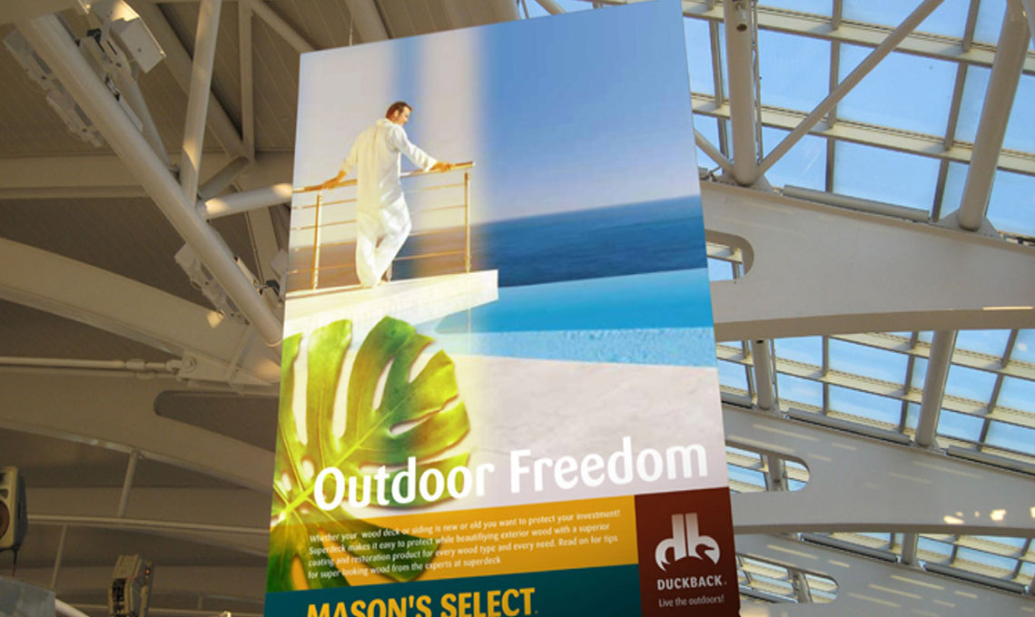 A large billboard advertising outdoor freedom in an airport featuring Duckback.