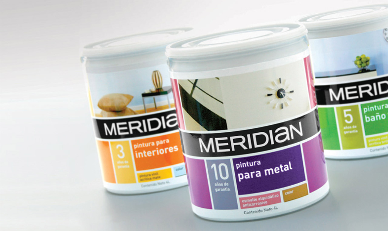 Three cans of meridian are sitting on a table.
