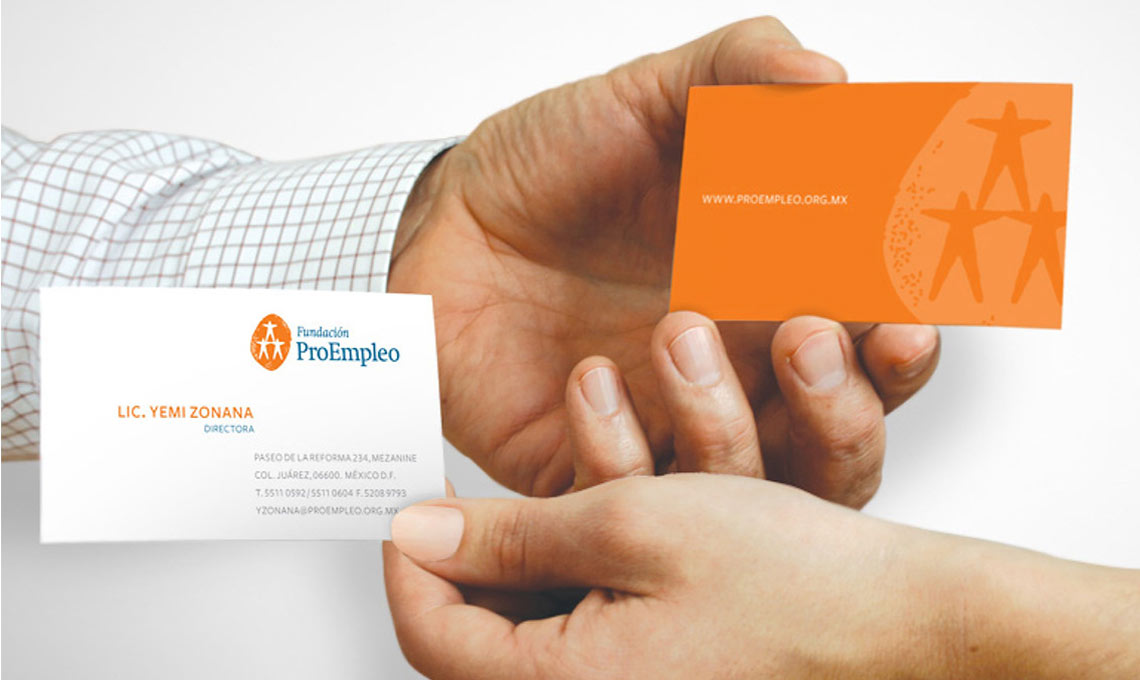 A hand holding a ProEmpleo business card.