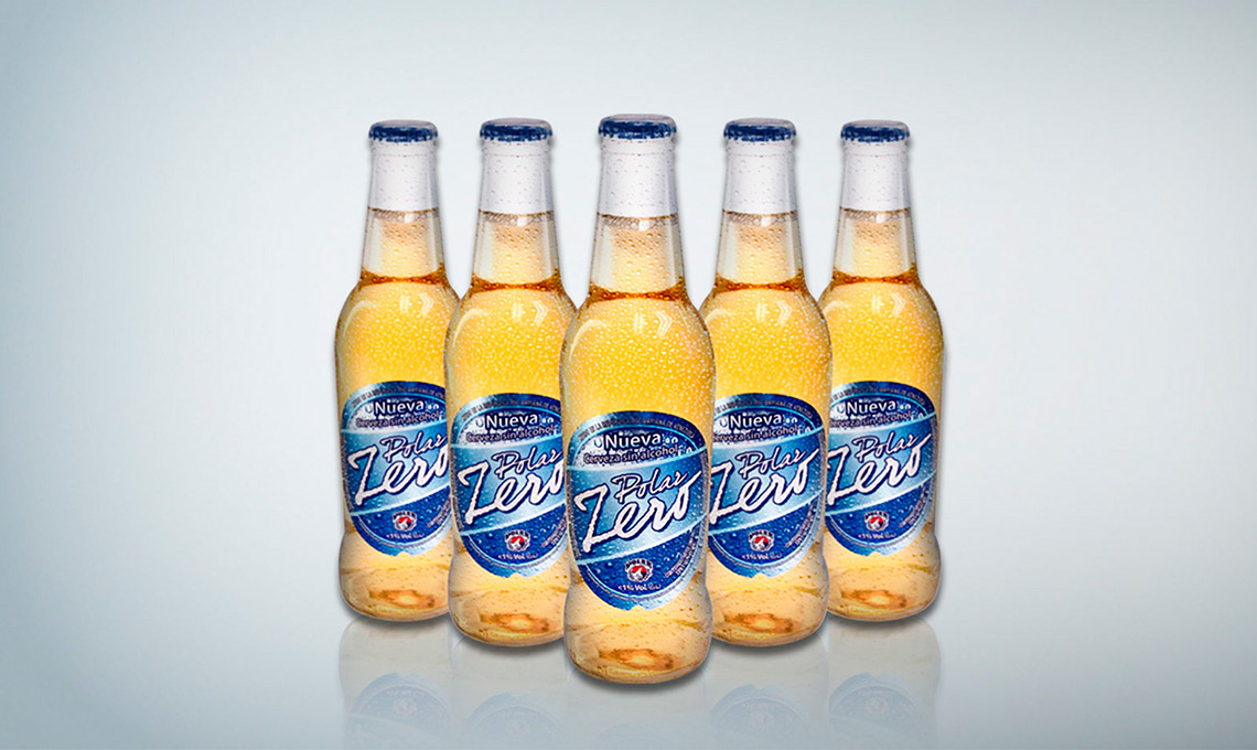Six bottles of Cervecería Polar beer on a white background.