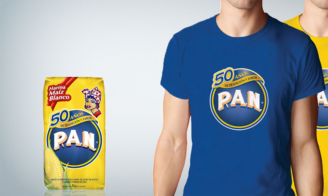 Two men wearing t-shirts with the word P.A.N. on them.