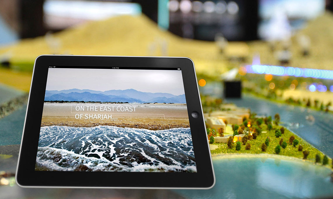 An Exhibition Design featuring an iPad displaying a model of a city.