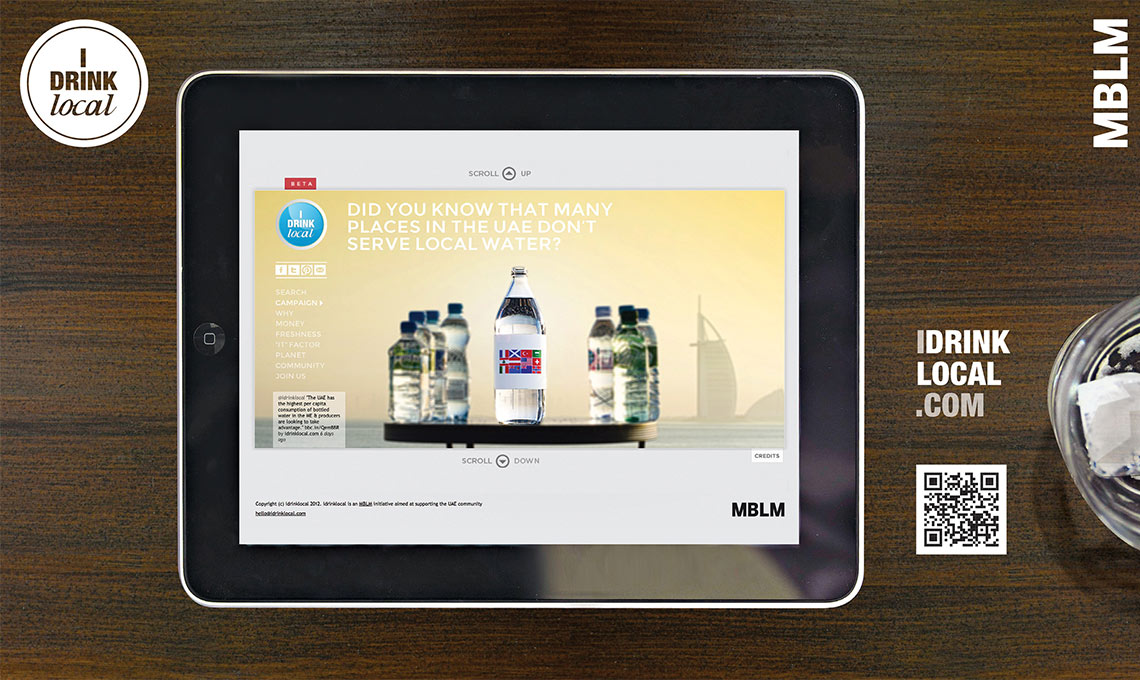 An iPad with a bottle of water on it, promoting local drinking.