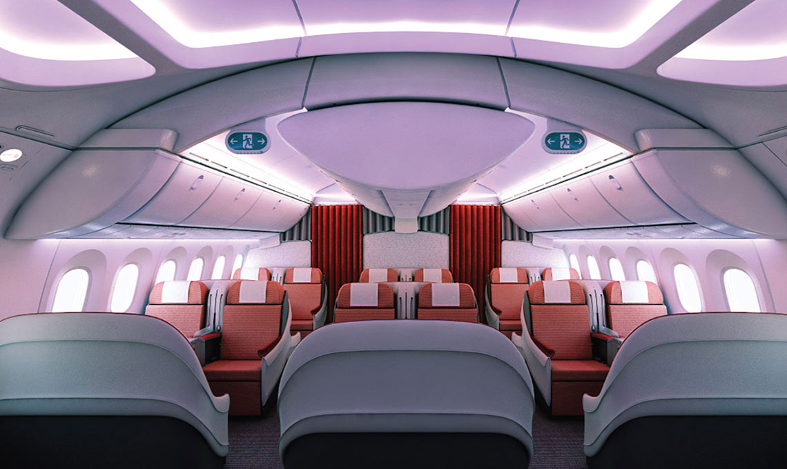 The interior of an airplane with seats and red lights.