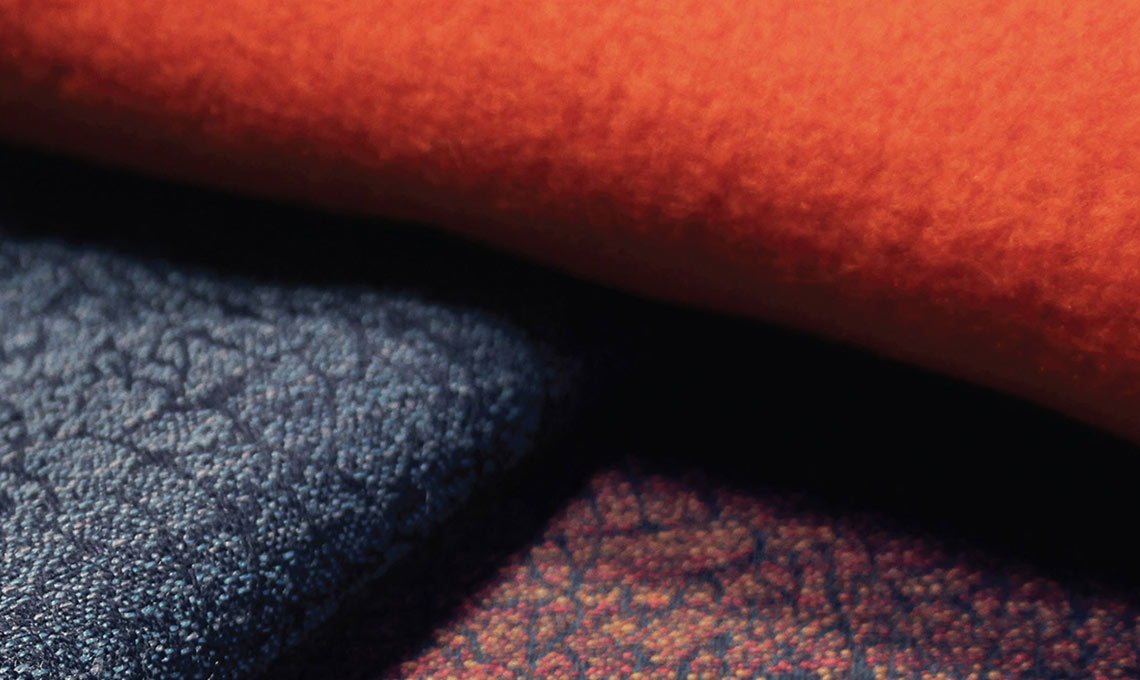 A close up of an orange and black fabric.