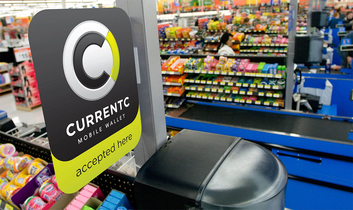 A sign in a store promoting Currentc.