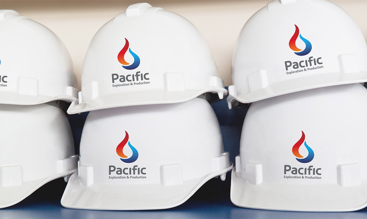 Four hard hats with the pacific logo on them undergo brand repositioning.