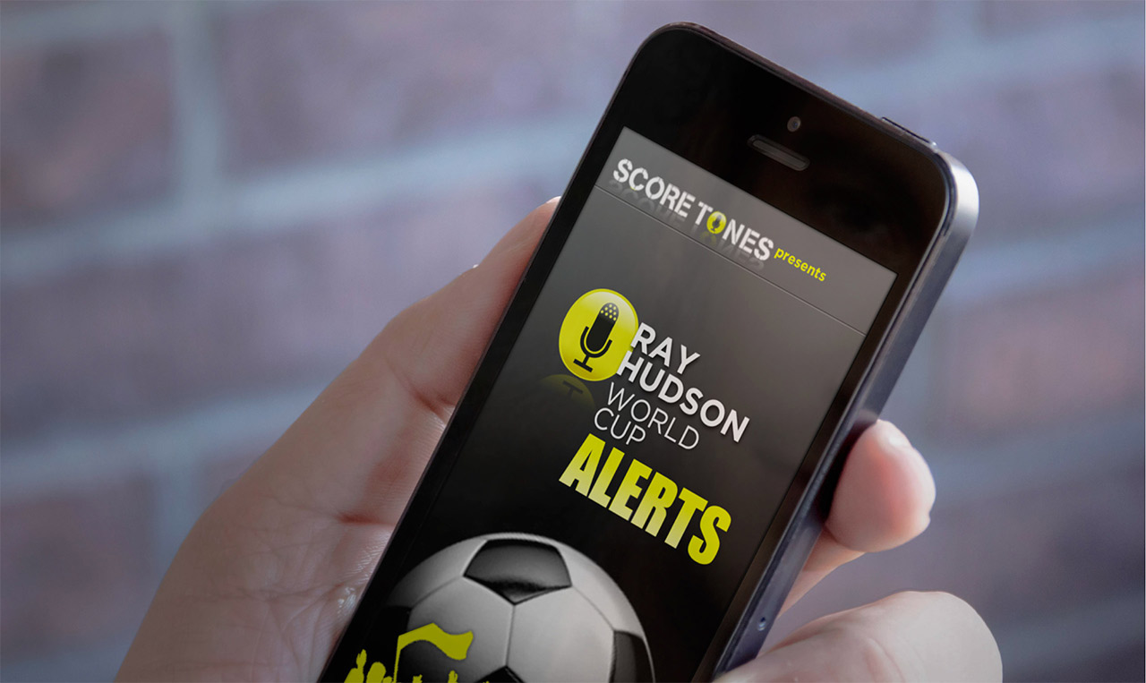 A person showcasing a mobile application with a soccer ball on it.