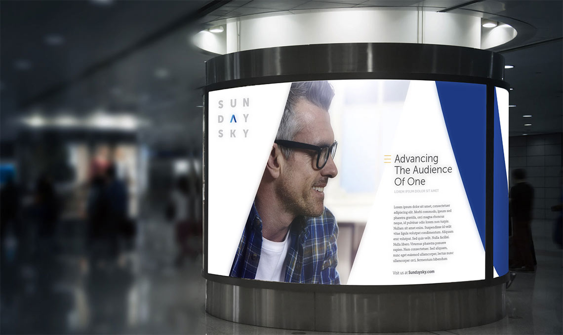 A billboard featuring a man in glasses promoting a brand.