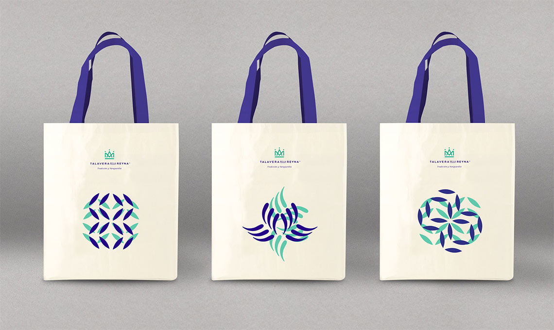 Three tote bags with distinct designs on them, fusing royal tradition.