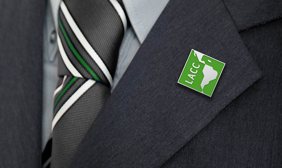 the logo of LACC applied as a pin on a suit lapel