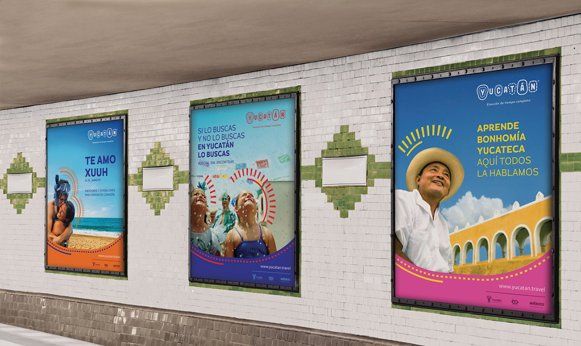 A collection of posters in a subway station showcasing destination branding.