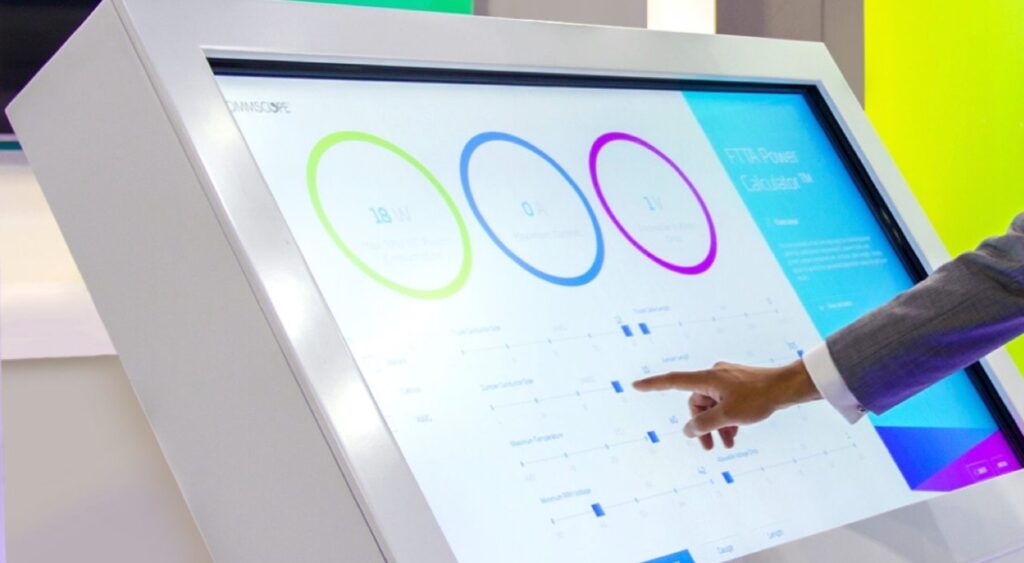 a person pointing at a touch screen with a presentation created with PresentationOS
