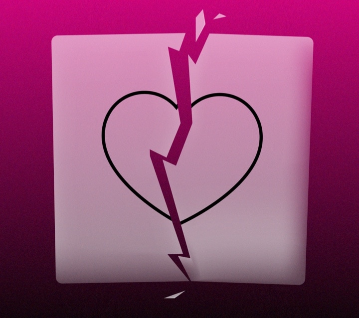 A broken heart on a pink background.