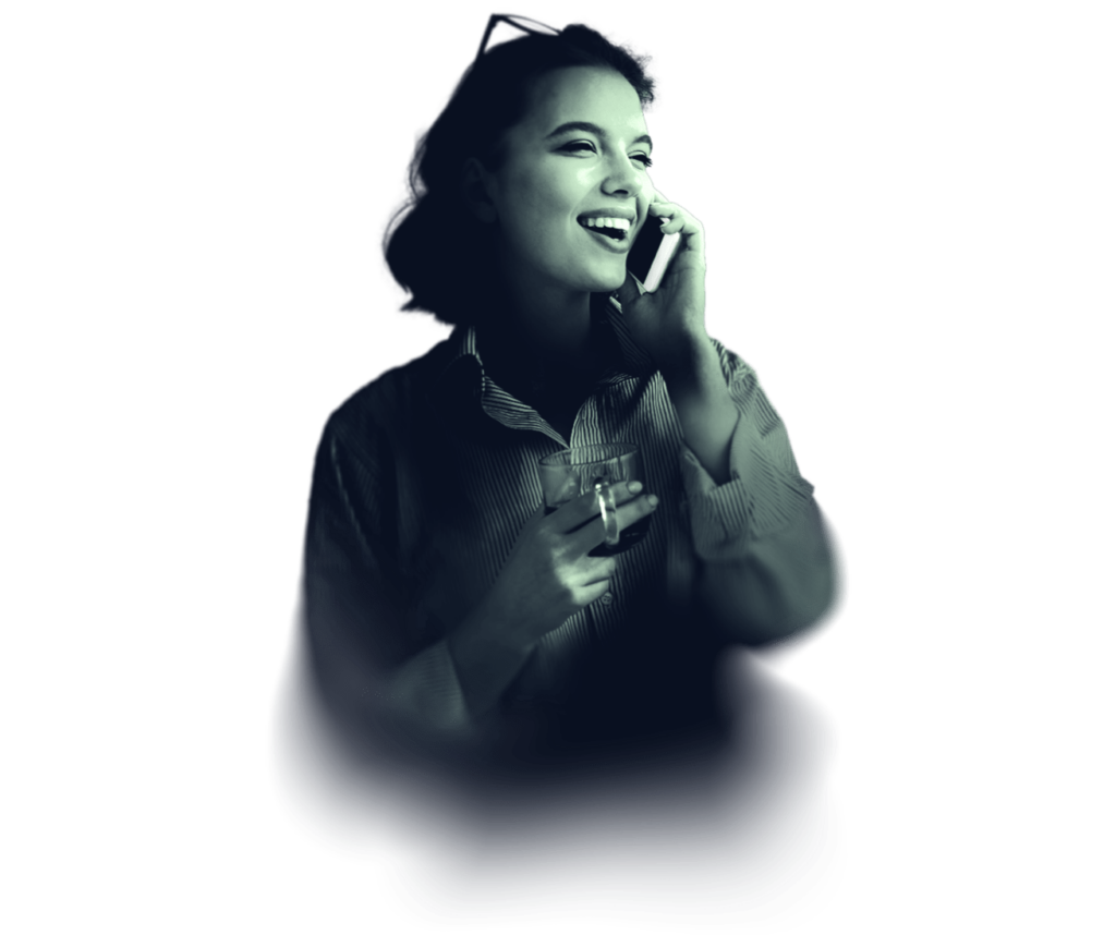 A happy young woman talking with a smartphone