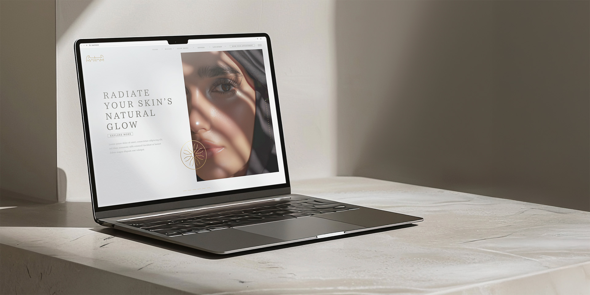 A laptop on a stone surface displays a skincare website with a close-up photo of a woman's face and the text "Radiate Your Skin's Natural Glow.