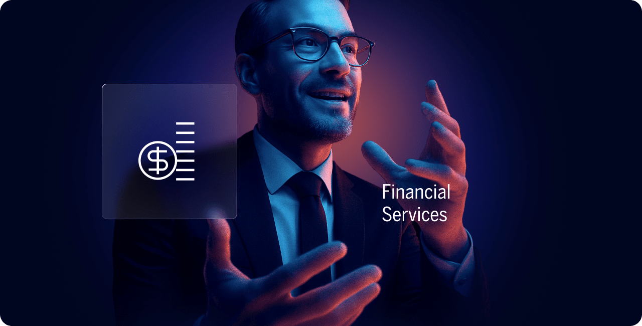 A man in a suit gestures while speaking, with a financial icon and the words "Financial Services" displayed beside him against a dark background.