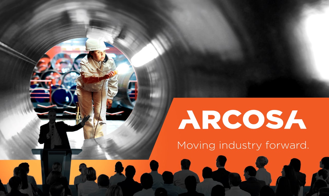 A worker inspects the inside of a large metal pipe; in the foreground, a speaker addresses an audience beside the Arcosa logo and slogan, “Moving industry forward.”.