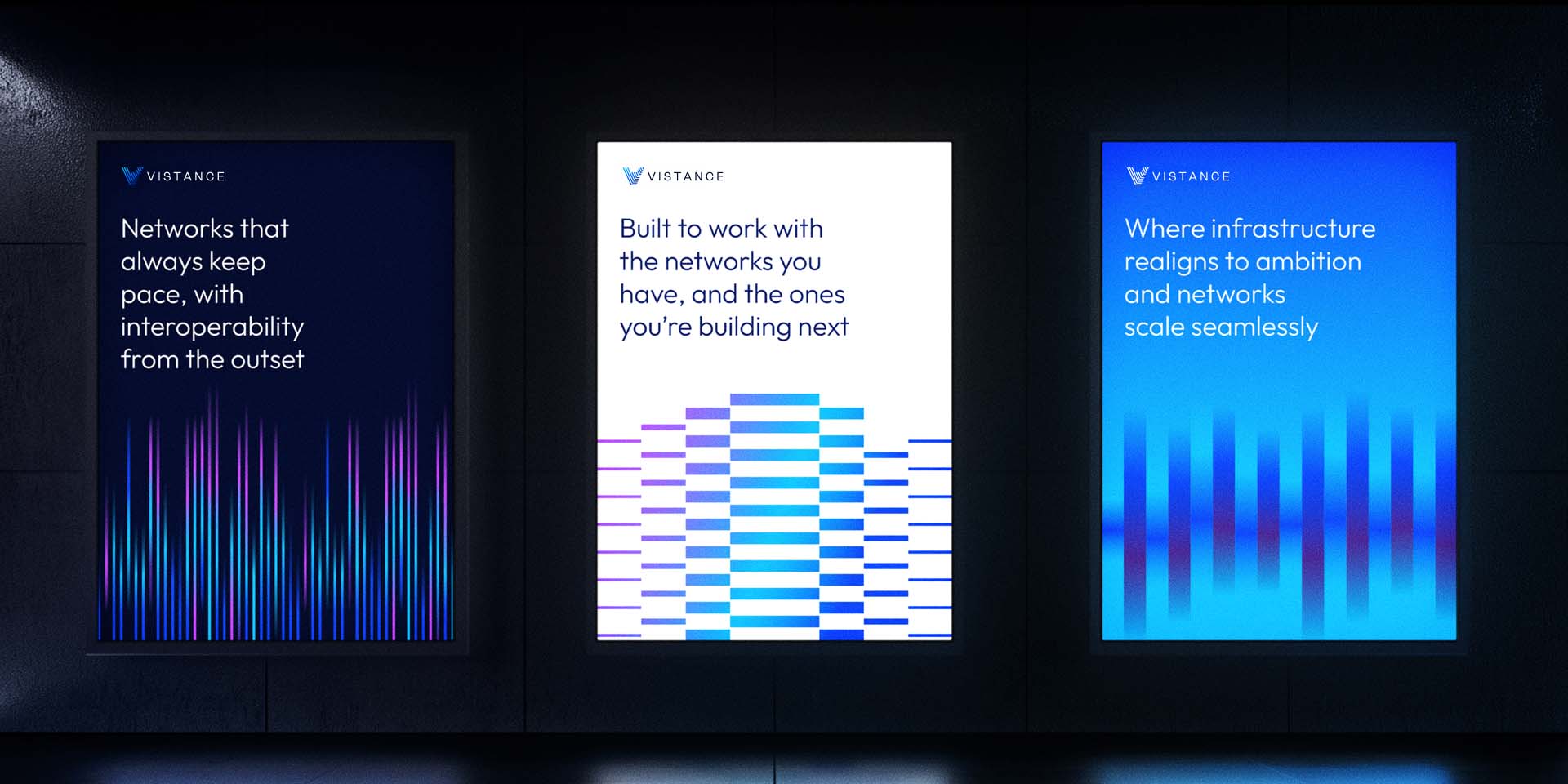 Three illuminated posters with text about network infrastructure and abstract vertical line graphics in blue and purple tones, displayed on a dark wall.
